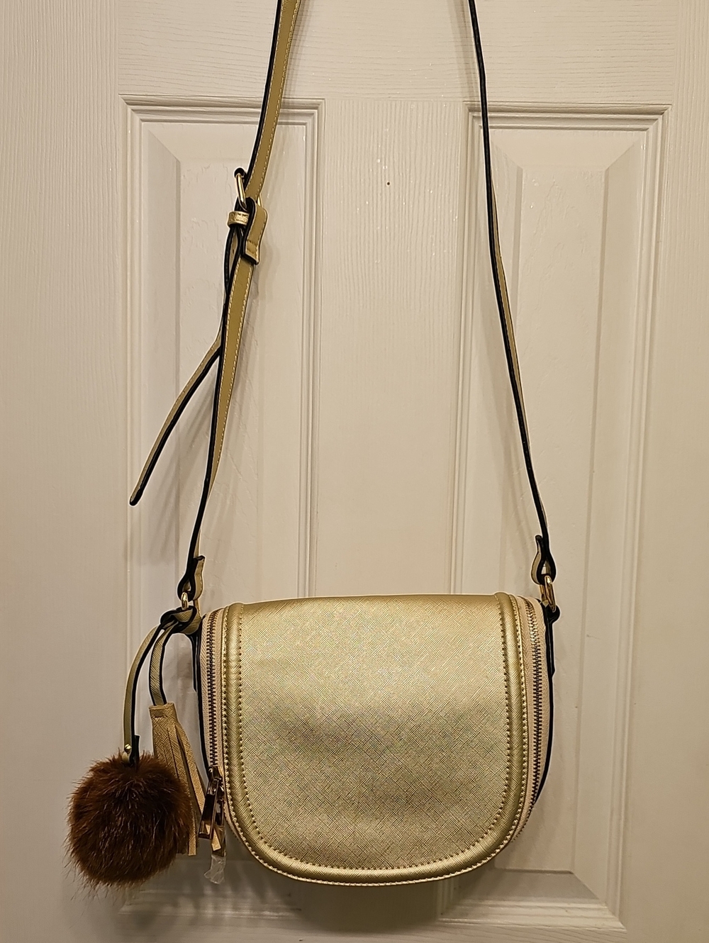 Gold Crossbody Saddle Bag with Pom Pom